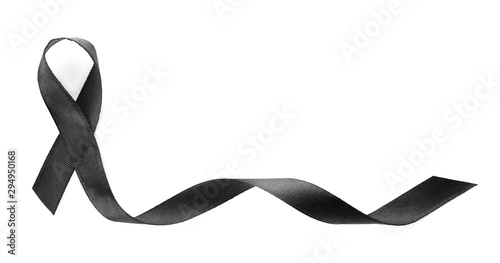Black ribbon on white background, top view. Funeral symbol