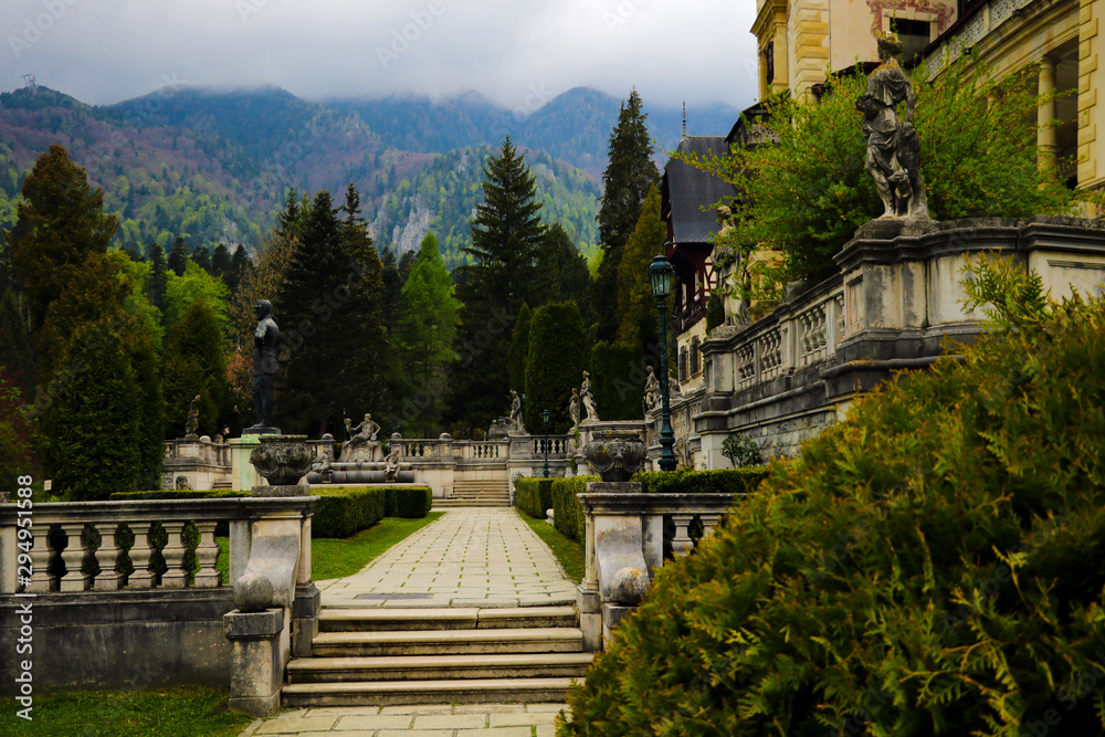 Sinaia, Romania, May 17, 2019: Beautiful Peles castle and ornamental garden in Sinaia landmark of Carpathian mountains in Romania.