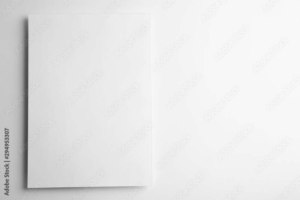 Blank paper sheet on white background, top view. Mock up for design