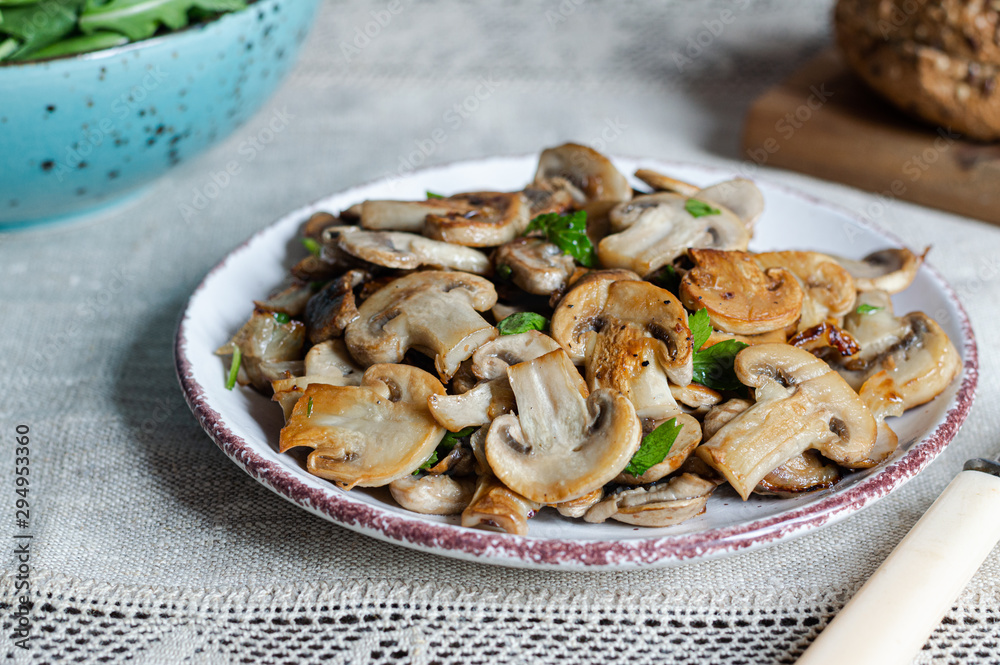 Champignons mushrooms sauteed with onion and garlic Champignons mushrooms sauteed with onion and garlic