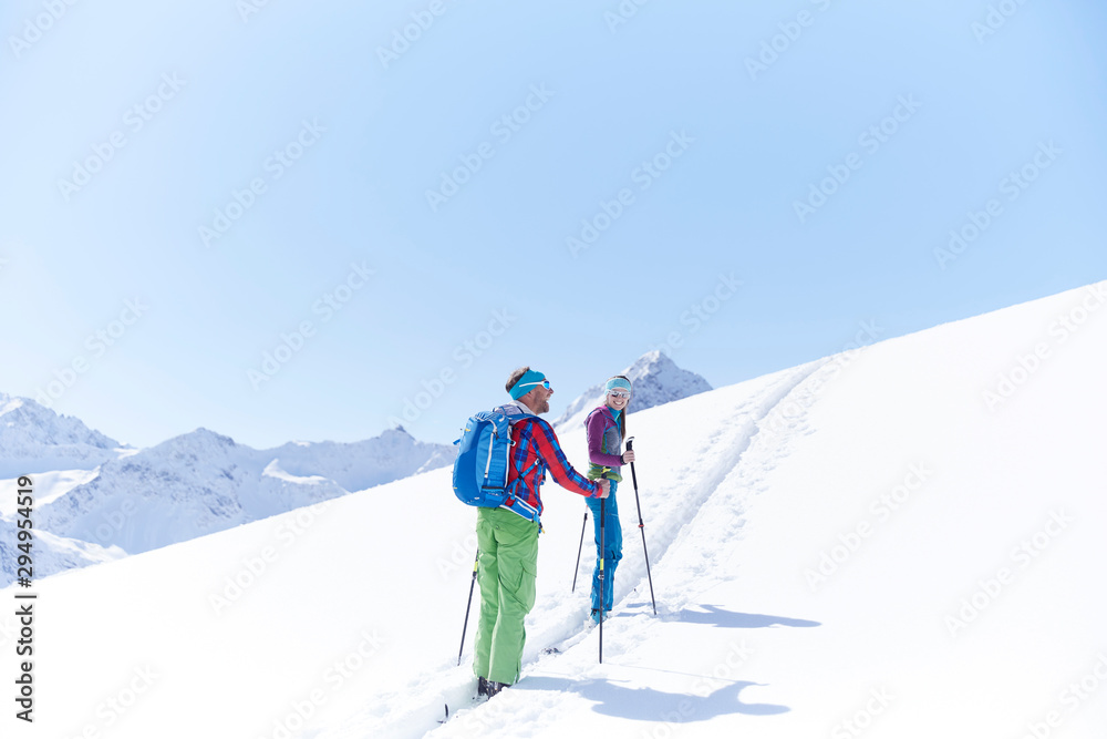 Couple ski touring in the mountains, Kuehtai, Tyrol, Austria Couple ski touring in the mountains, Kuehtai, Tyrol, Austria