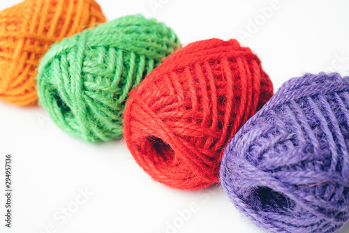 Colorful yarn balls as isolated white background, close up