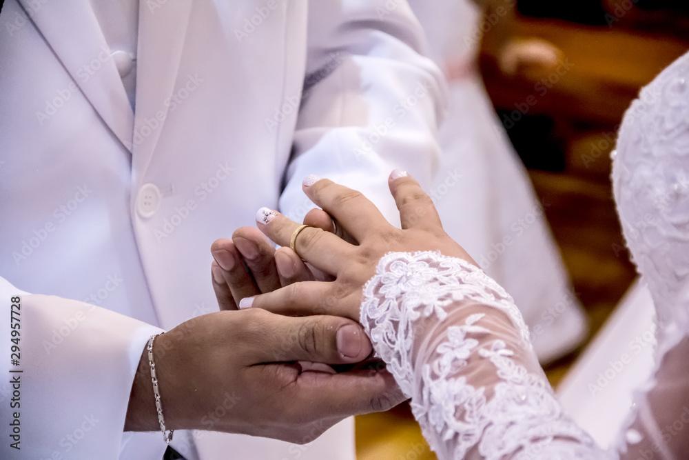 The moment of exchanging wedding rings. The moment of exchanging wedding rings.