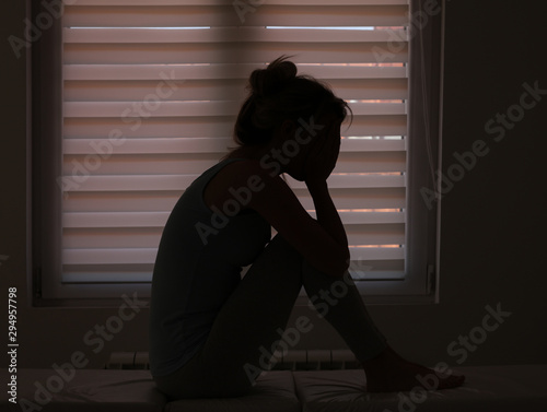 Canvastavla Depression concept. Silhouette of sad, crying woman