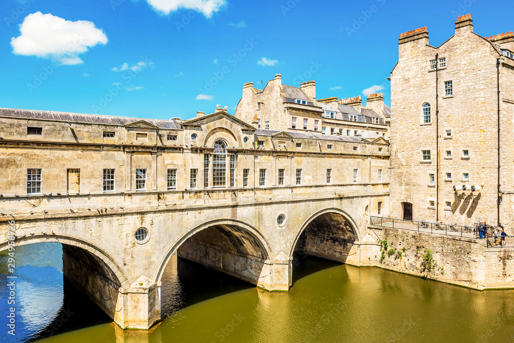 The Pulteney Bridge in Palladian style crosses the River Avon in Bath