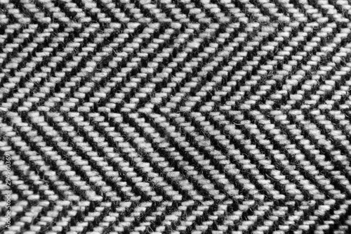 Canvas Print The herringbone tweed wool fabric texture background closeup