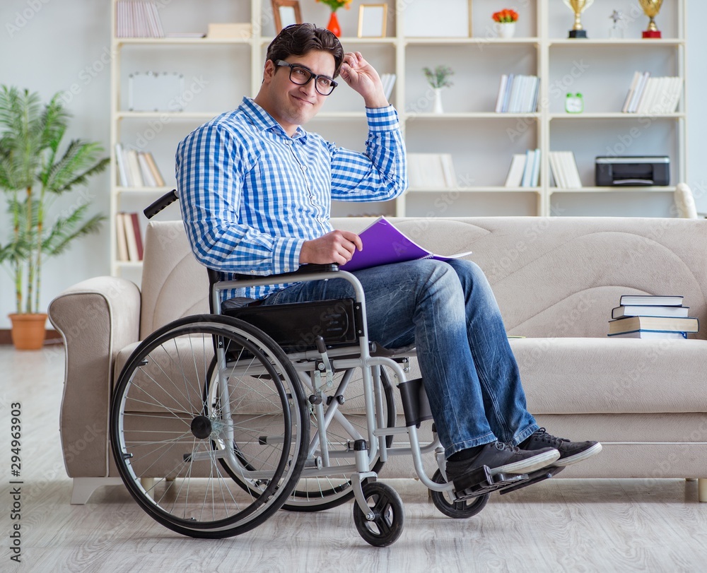 Young student on wheelchair in disability concept
