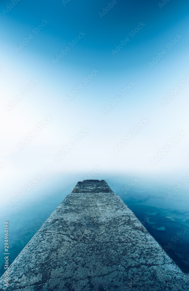 Perspective Cement pier with beautiful sea nature background. Abstract long exposure photography gradient wallpaper advertise. Concept desktop relax