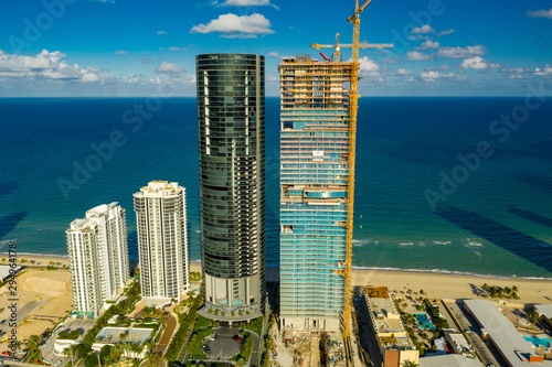 Aerial photo Porsche Design Tower and Turnberry Ocean Club luxury highrise condominiums on the beach