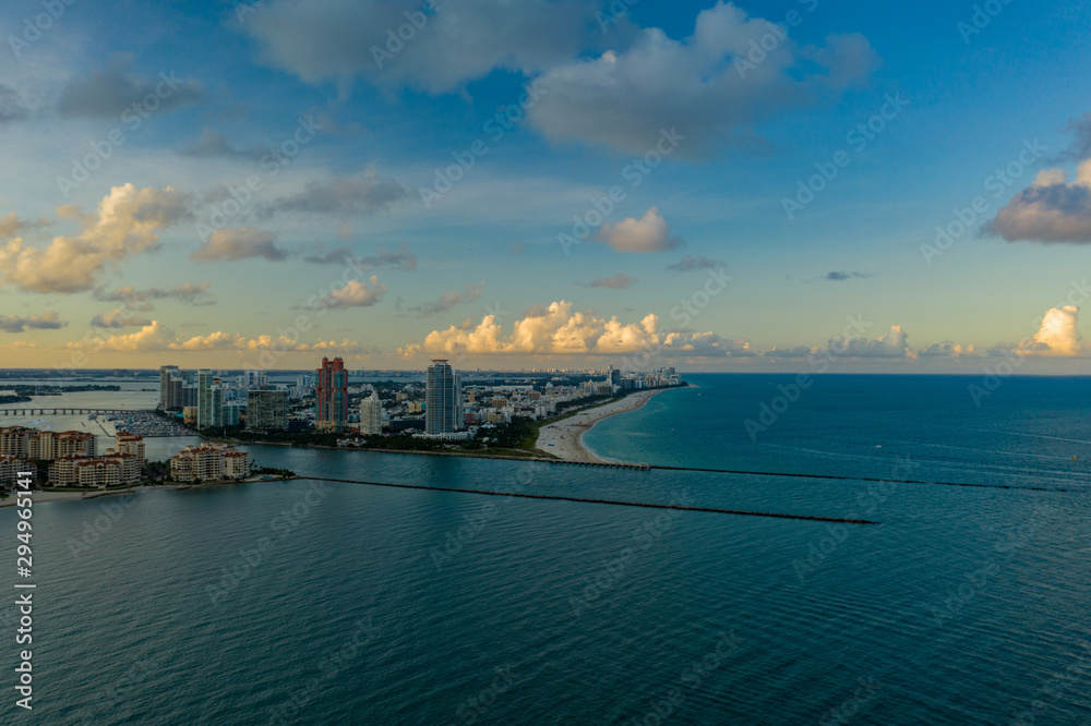 Aerial photo Miami Beach inlet at dusk Atlantic Ocean and coastal city scene