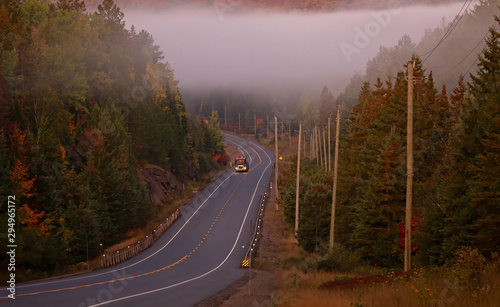 A lone truck on an early fall morning along Highway 60 in Algonquin Park, Canada
