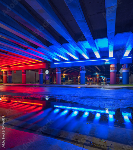 Neon red and blue lights under the bridge Miami Design District
