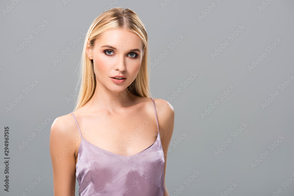 elegant blonde girl in violet satin dress isolated on grey elegant blonde girl in violet satin dress isolated on grey