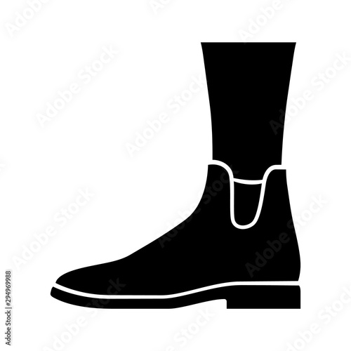 Women ankle boots glyph icon. Chelsea trendy shoes side view. Female flat heel footwear for fall season. Ladies clothing accessory. Silhouette symbol. Negative space. Vector isolated illustration