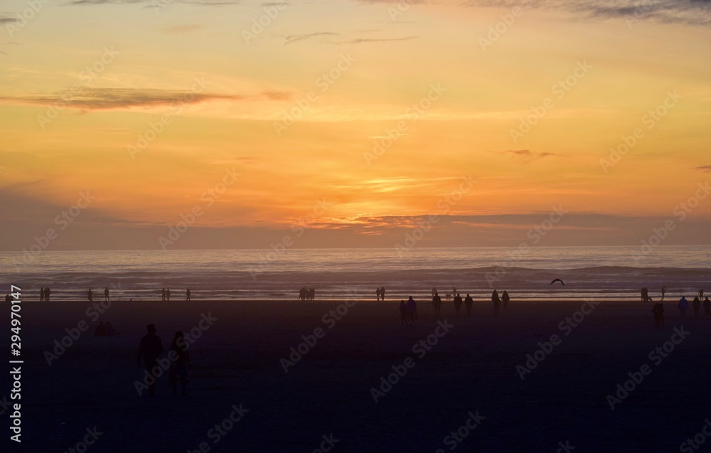 walking on the beach at sunset-Seaside, Oregon walking on the beach at sunset-Seaside, Oregon
