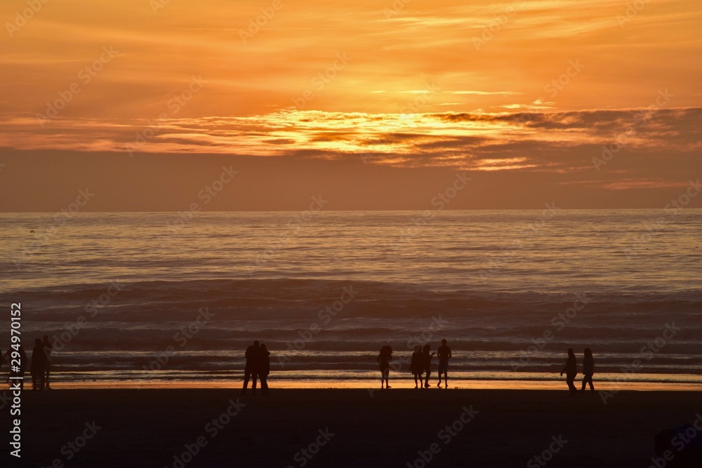 Walking on the beach at sunset