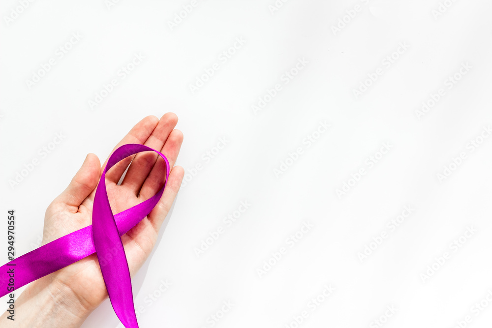 Lilac ribbon in hands is symbol of Alzheimers disease on white background top view space for text Lilac ribbon in hands is symbol of Alzheimers disease on white background top view space for text