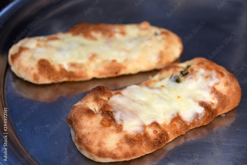 pizza bread with cheese and vegetables