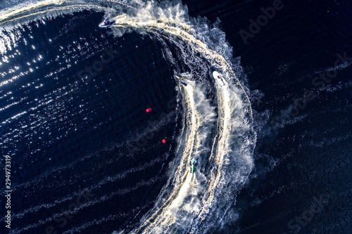 Powerboat racing from above isolated on dark water background.