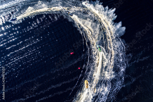 Powerboat racing from above isolated on dark water background.