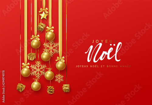 French text Joyeux Noel. Merry Christmas and Happy New Year. Golden christmas balls hanging design on the ribbon, gold gift and bright snowflakes in the shape of pine tree.