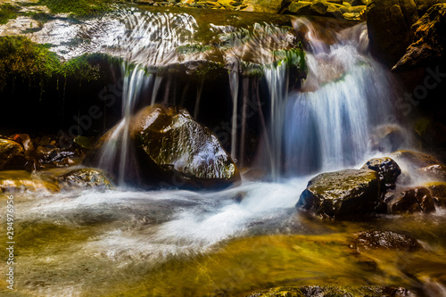 Streaming waterfall landscape photo.