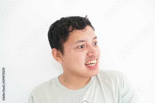 Portrait of smiling disable asian men standing on white background