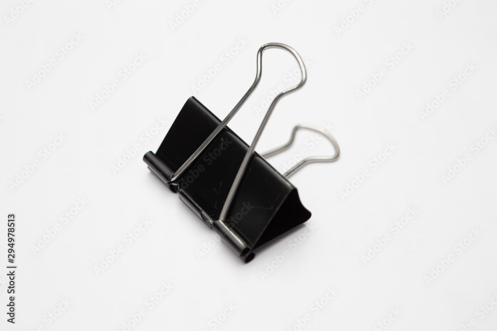 Close up of Black paper clip on white background Close up of Black paper clip on white background