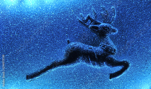 Symbol of christmas deer on sparkling background.