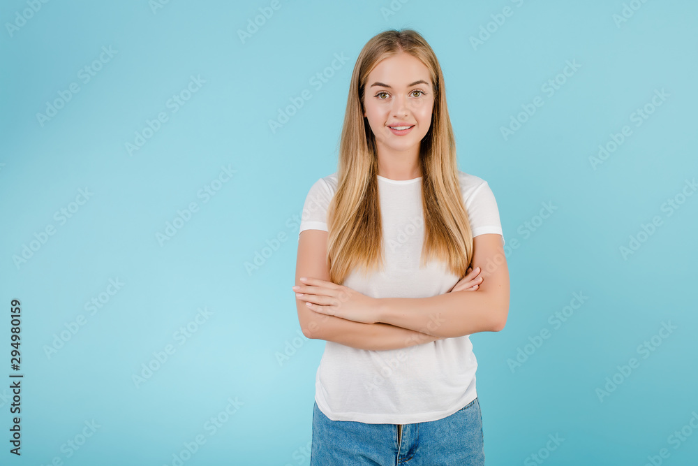 smiling friendly blonde girl isolated over blue smiling friendly blonde girl isolated over blue