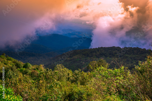 The high mountain panorama nature background, the color of the light changes according to the climate, the wind and the blurred coolness of the mist blowing through, the integrity of the forest