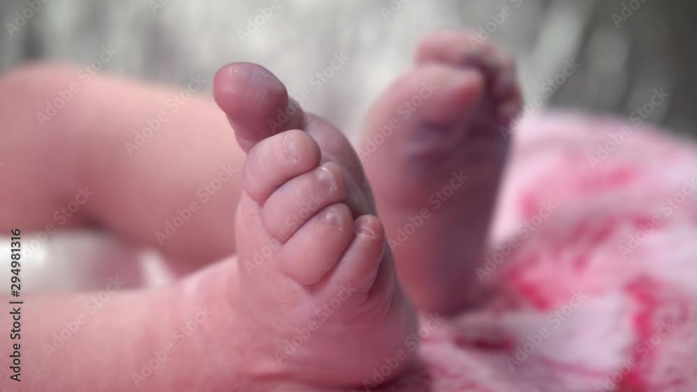 new born baby moving his feets new born baby moving his feets