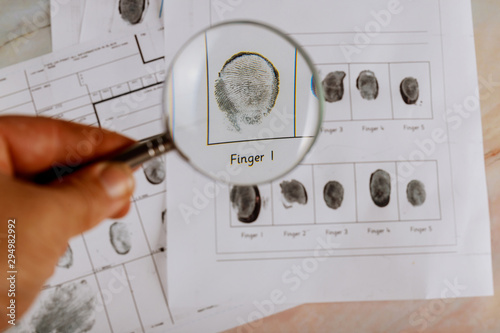 Criminal fingerprint card and magnifier Criminal investigation