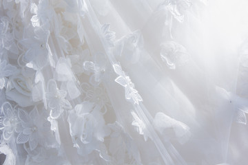 Details of the bride dress fabric and beautiful embroidery wedding concept used as a background for illustrations