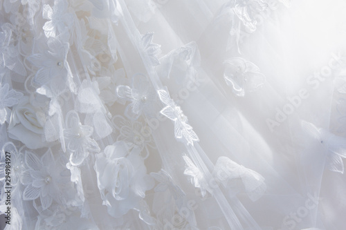 Details of the bride dress fabric and beautiful embroidery wedding concept used as a background for illustrations