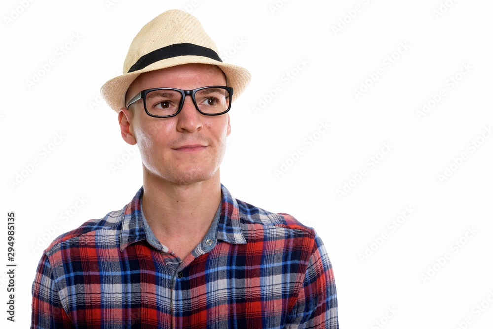 Studio shot of young handsome man wearing eyeglasses while think