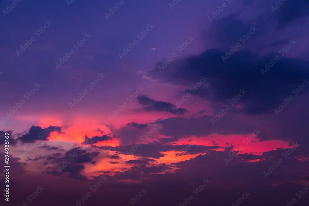 Evening sky with sunset light and colorful clouds as a background