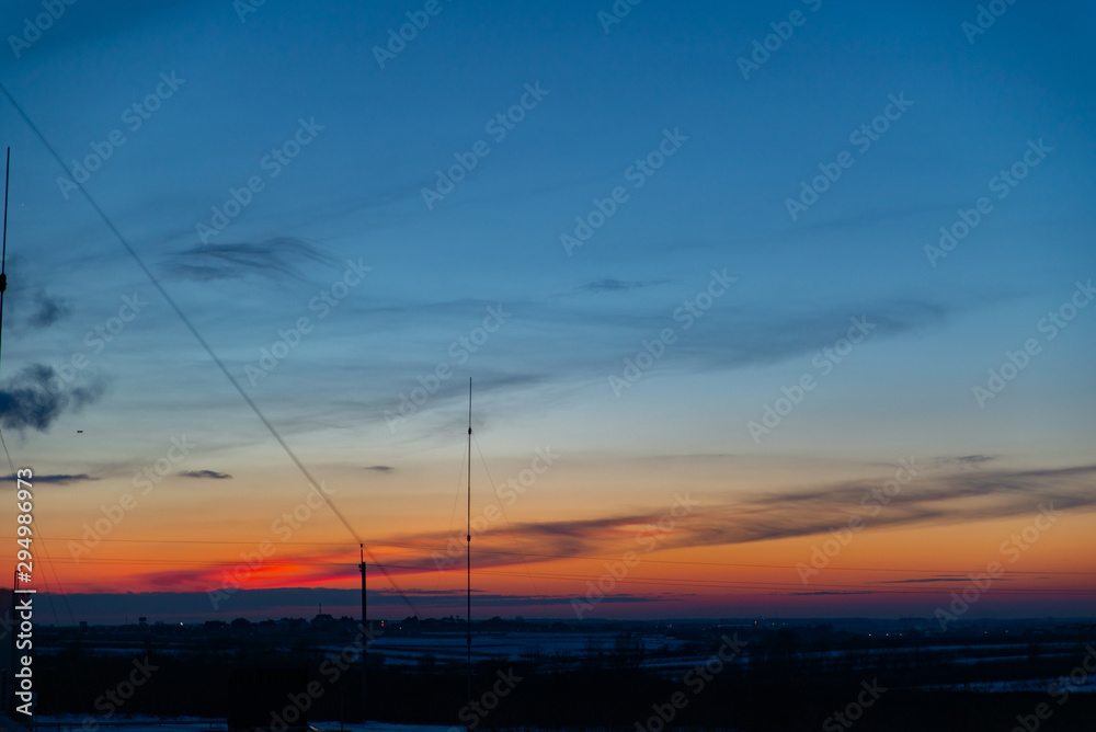 view of winter sunset over snowed field