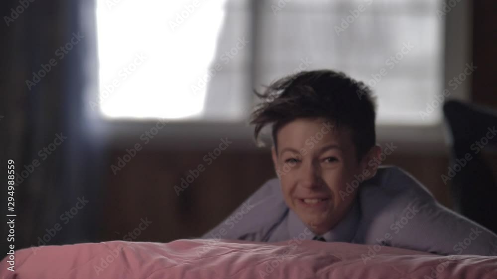 boy jump to the bed in the evening, slow motion boy jump to the bed in the evening, slow motion