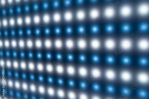 Defocused close-up of panel with bright luminous LEDs