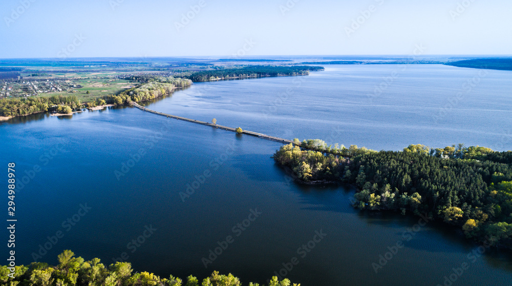 Flying over the river dam. Aerial camera shot. Ukraine.