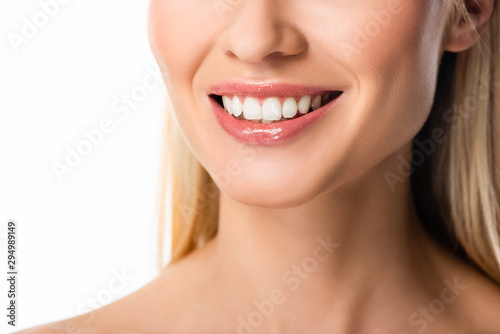 partial view of smiling blonde woman with white teeth isolated on white