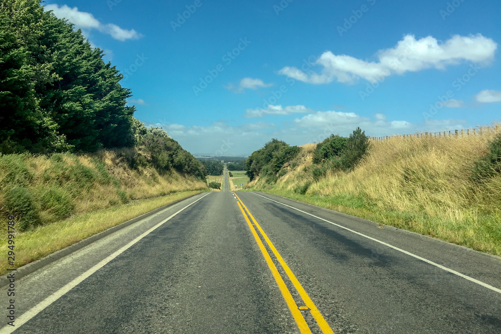 Empty Highway through Rural countryside in New Zealand