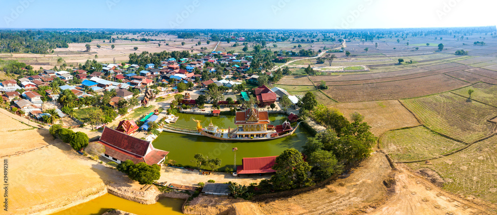 Aerial top view photo from flying drone of A huge Thai Suphannahong, also called Golden Swan or Phoenix boat at the WatpahSuphannahong Temple,Sisaket province,Thailand.