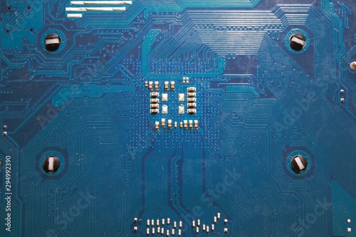 Back side of a blue computer mainboard