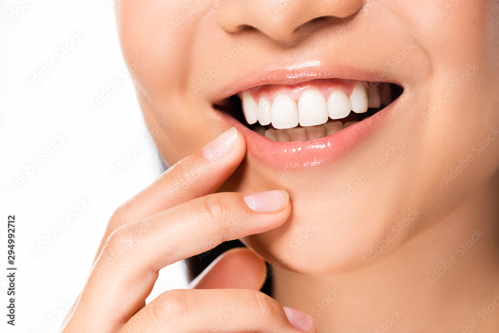 partial view of beautiful asian woman showing white teeth isolated on white partial view of beautiful asian woman showing white teeth isolated on white