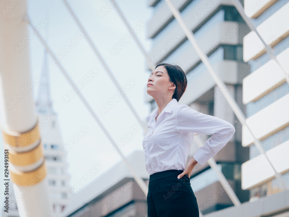 Asian young business woman with mobile phone