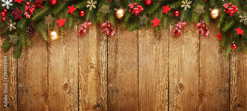 Christmas wooden banner with decoration and fir tree. View with copy space.