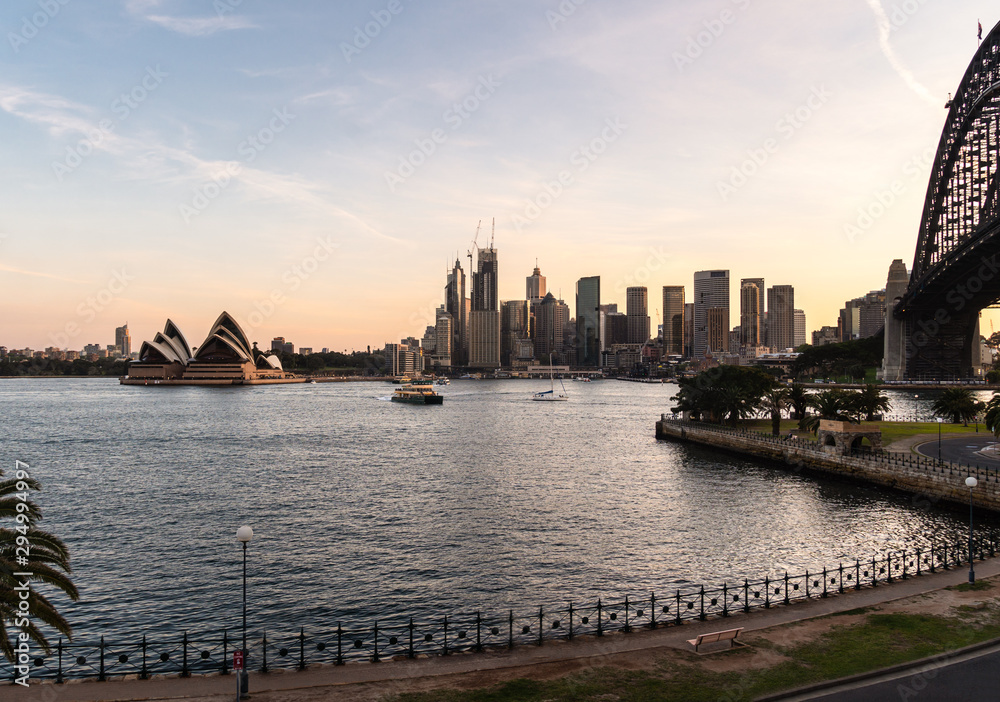 Evening over the famous Sydney harbor and the business district in Australia largest city