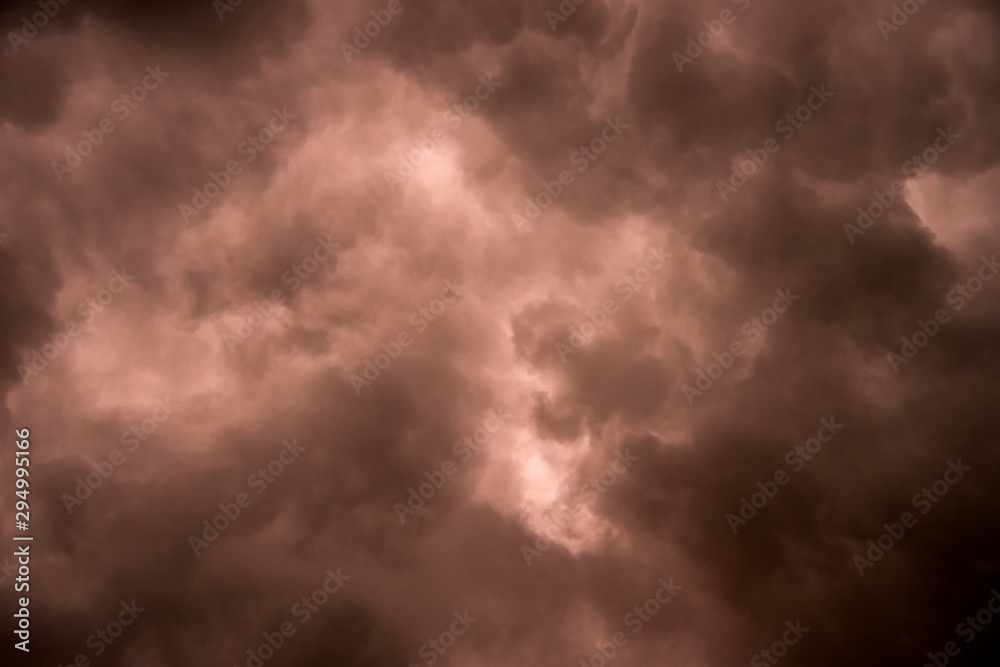 Dark sky and dramatic black cloud before rain.A tropical cyclone is a rapidly rotating storm system characterized by a low-pressure center, a closed low-level atmospheric circulation, strong winds. Dark sky and dramatic black cloud before rain.A tropical cyclone is a rapidly rotating storm system characterized by a low-pressure center, a closed low-level atmospheric circulation, strong winds.